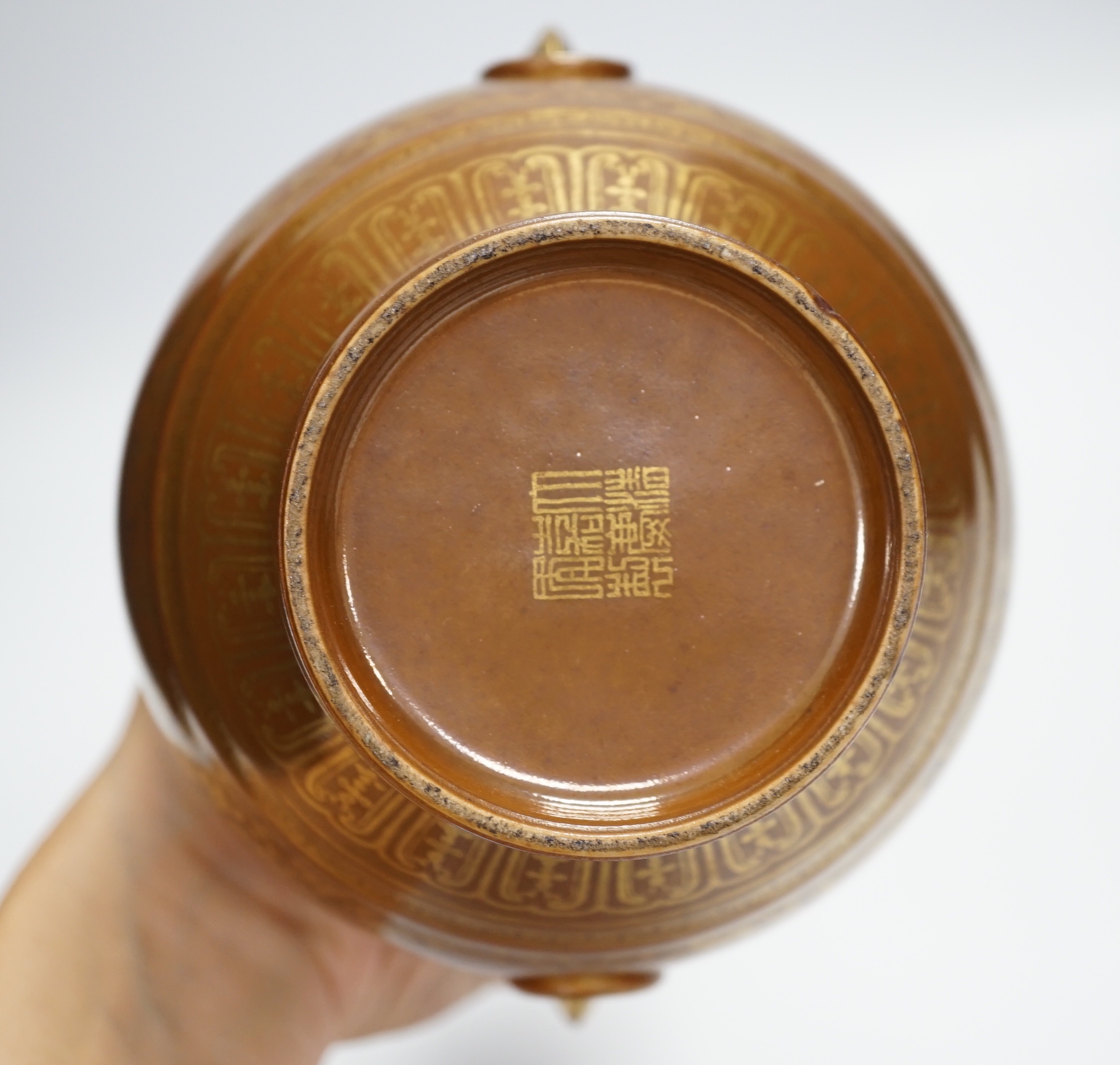 A Chinese porcelain imitation bronze vase, on a brown ground with gilt decoration, 19.5cm high